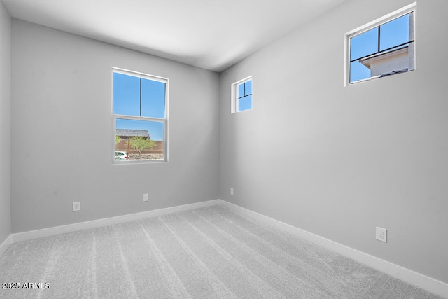 12219 W Caraveo Pl, Peoria, AZ 85383 - unfurnished room with baseboards and carpet floors