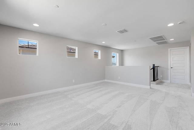 12219 W Caraveo Pl, Peoria, AZ 85383 - basement with light carpet, recessed lighting, and baseboards