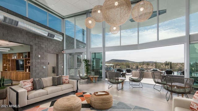 12219 W Caraveo Pl, Peoria, AZ 85383 - living area with expansive windows and a towering ceiling