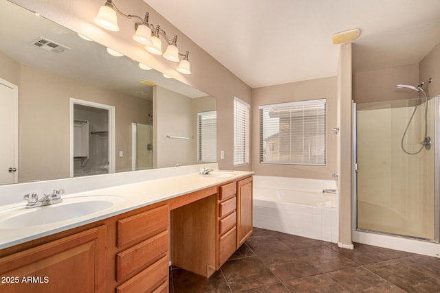 full bathroom with a stall shower, visible vents, and a sink