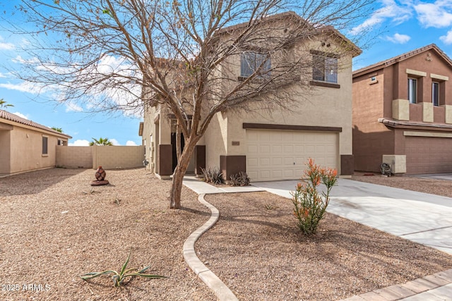 view of front facade featuring driveway, a garage, fence, and stucco siding