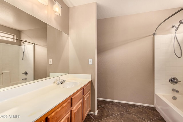 bathroom with shower / washtub combination, tile patterned flooring, vanity, and baseboards