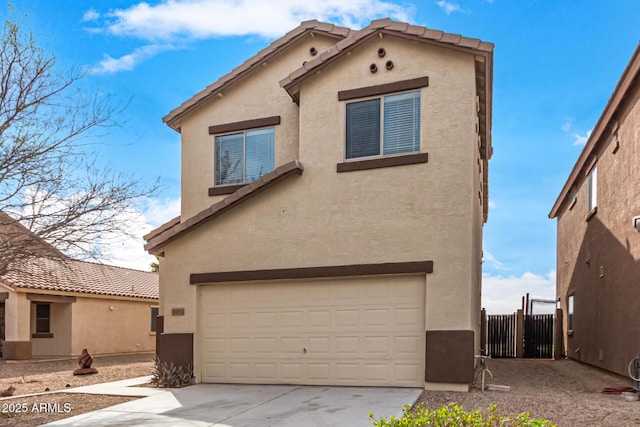 view of front of property with a garage, concrete driveway, a tiled roof, and stucco siding