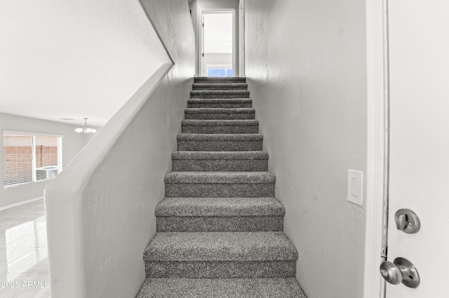 11215 W Heatherbrae Dr, Phoenix, AZ 85037 - stairs with a chandelier