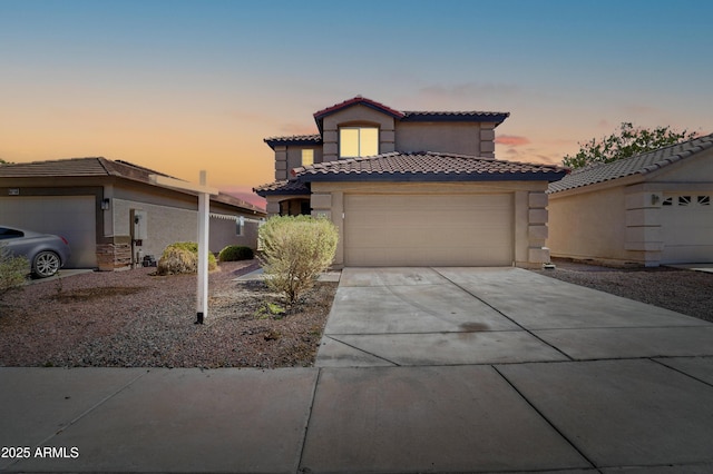 11215 W Heatherbrae Dr, Phoenix, AZ 85037 - mediterranean / spanish home with a tile roof, stucco siding, driveway, and an attached garage
