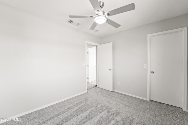 11215 W Heatherbrae Dr, Phoenix, AZ 85037 - unfurnished bedroom featuring carpet floors, baseboards, and a ceiling fan