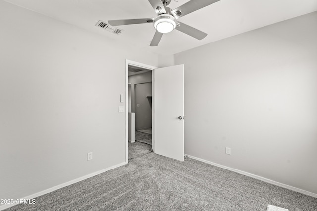 11215 W Heatherbrae Dr, Phoenix, AZ 85037 - spare room featuring carpet floors, a ceiling fan, and baseboards