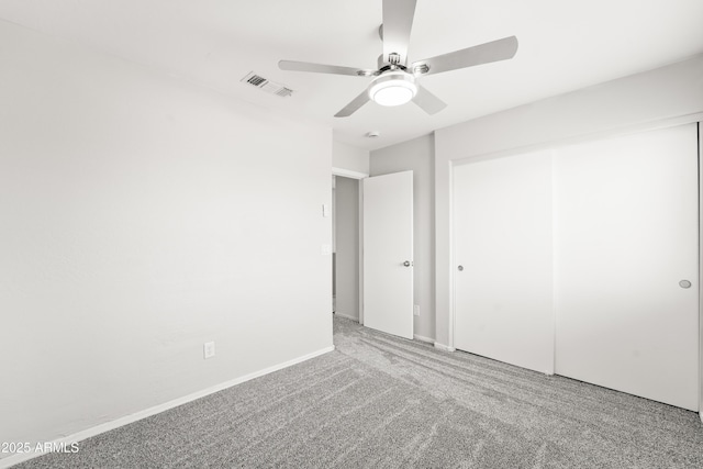 11215 W Heatherbrae Dr, Phoenix, AZ 85037 - unfurnished bedroom with carpet, a closet, a ceiling fan, and baseboards
