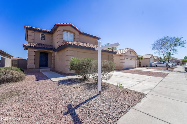 11215 W Heatherbrae Dr, Phoenix, AZ 85037 - mediterranean / spanish-style home with driveway, a tiled roof, a garage, and stucco siding