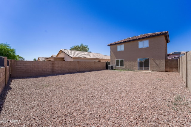11215 W Heatherbrae Dr, Phoenix, AZ 85037 - back of property with stucco siding, a tiled roof, and a fenced backyard