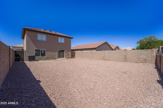 11215 W Heatherbrae Dr, Phoenix, AZ 85037 - rear view of property featuring cooling unit, a fenced backyard, and stucco siding