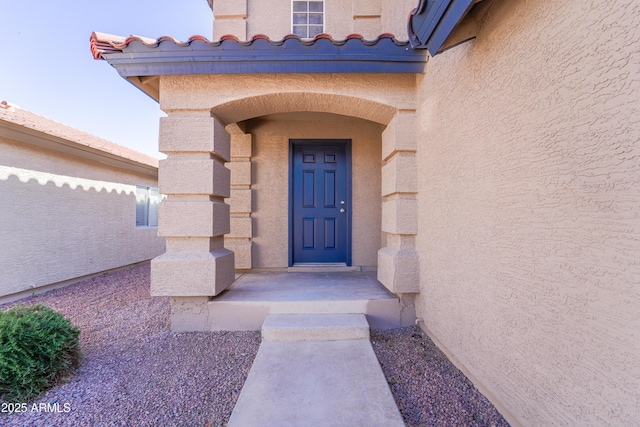 11215 W Heatherbrae Dr, Phoenix, AZ 85037 - doorway to property featuring stucco siding