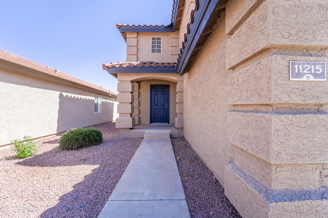 11215 W Heatherbrae Dr, Phoenix, AZ 85037 - property entrance featuring stucco siding and a tile roof