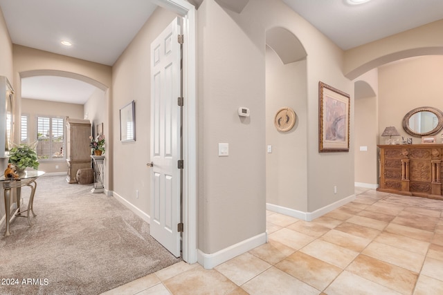 corridor with light carpet