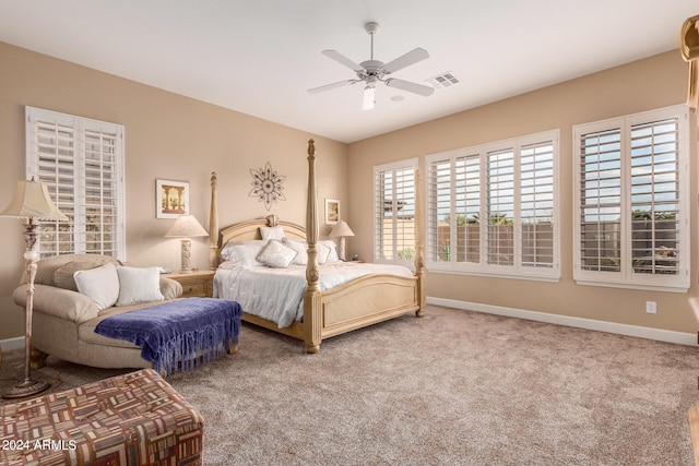 bedroom with ceiling fan and carpet floors