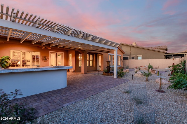 exterior space with a pergola and a patio area