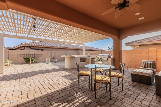 view of patio featuring a pergola, ceiling fan, and a grill