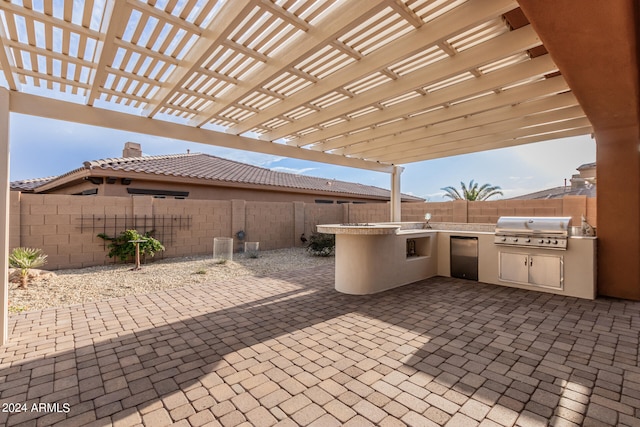 view of patio / terrace featuring area for grilling, an outdoor kitchen, and a pergola