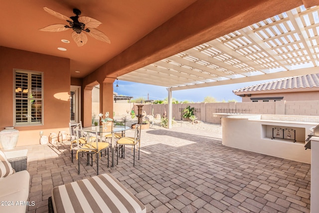 view of patio / terrace featuring ceiling fan and a pergola