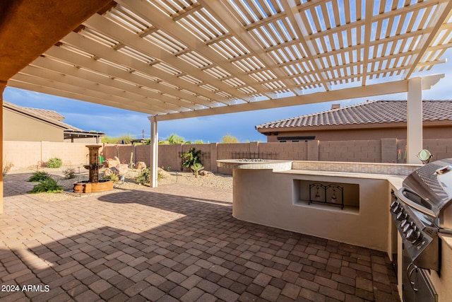 view of patio with a pergola and a grill