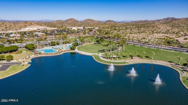 drone / aerial view featuring a water and mountain view