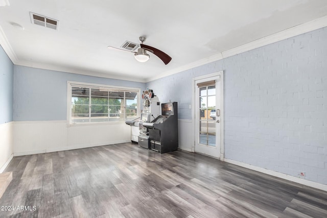 unfurnished room with dark hardwood / wood-style flooring, ceiling fan, and plenty of natural light