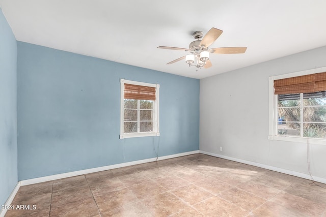 unfurnished room with plenty of natural light and ceiling fan