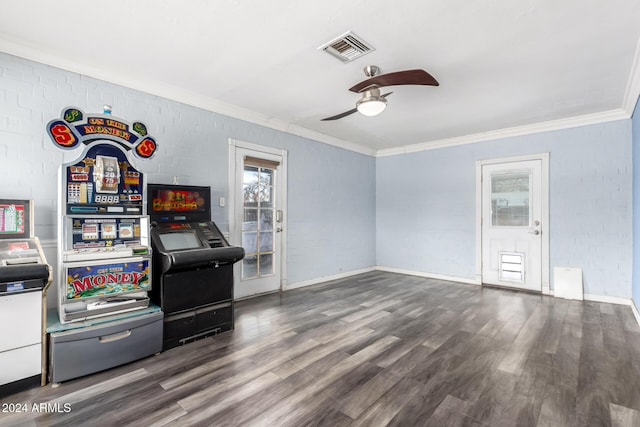 interior space with ceiling fan, dark hardwood / wood-style flooring, and crown molding