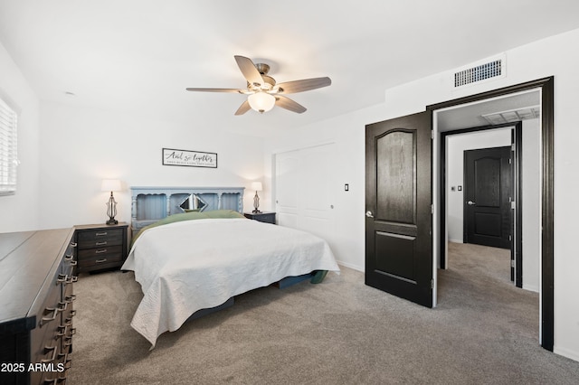 bedroom featuring carpet floors, a closet, and ceiling fan