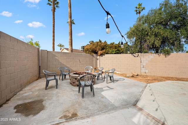 view of patio / terrace featuring a fire pit