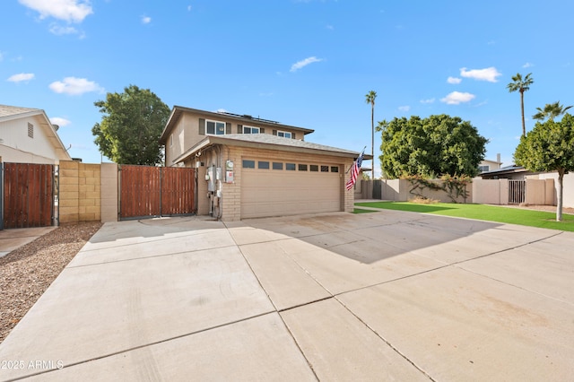 view of front facade with a garage and a front lawn