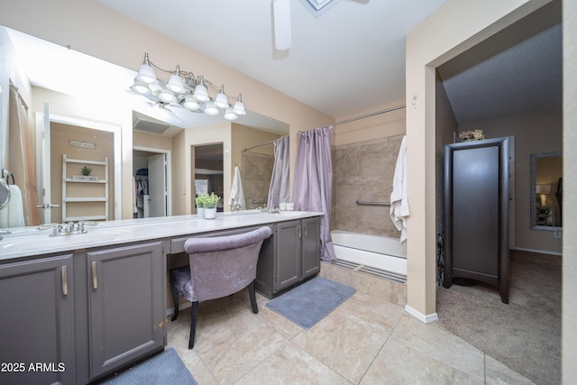 full bathroom featuring tiled shower / bath combo, vanity, a ceiling fan, and tile patterned floors