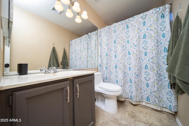 bathroom with a chandelier, curtained shower, toilet, vanity, and tile patterned floors