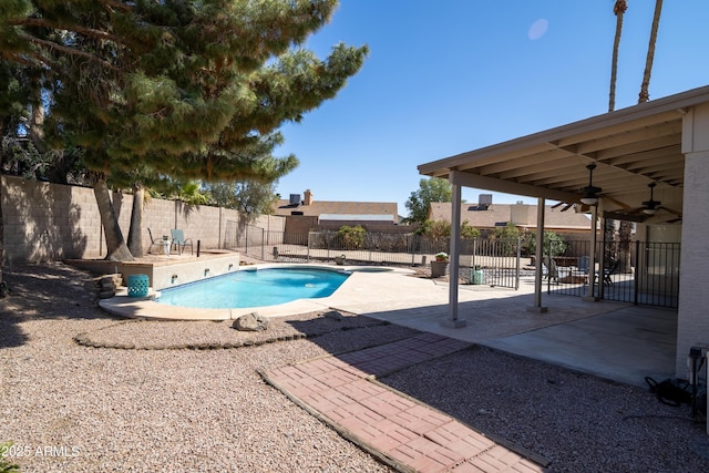 view of swimming pool featuring a fenced backyard, a patio, and ceiling fan