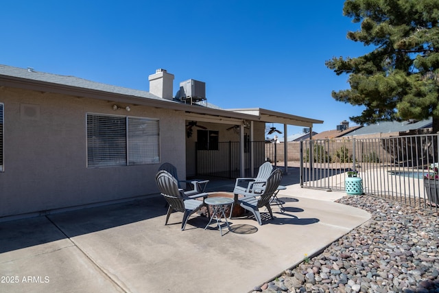 view of patio / terrace featuring fence and central air condition unit