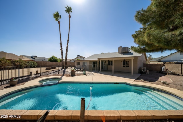 view of pool with central AC unit, a ceiling fan, a fenced backyard, a patio area, and a pool with connected hot tub