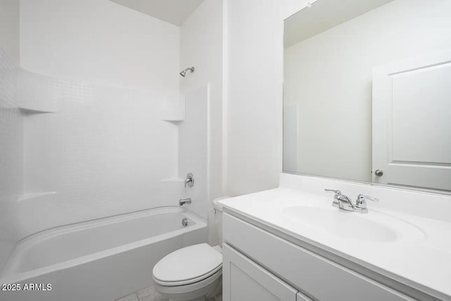 bathroom with tub / shower combination, vanity, and toilet