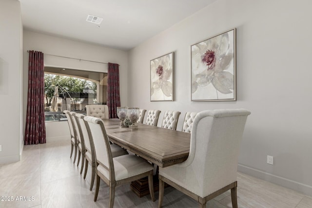 dining area with baseboards and visible vents