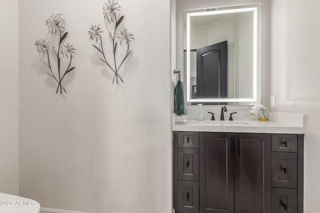 half bath with vanity and toilet