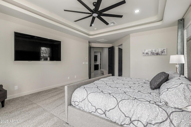 bedroom featuring carpet, baseboards, a raised ceiling, and recessed lighting