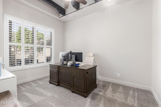 office area featuring light carpet, ceiling fan, and baseboards