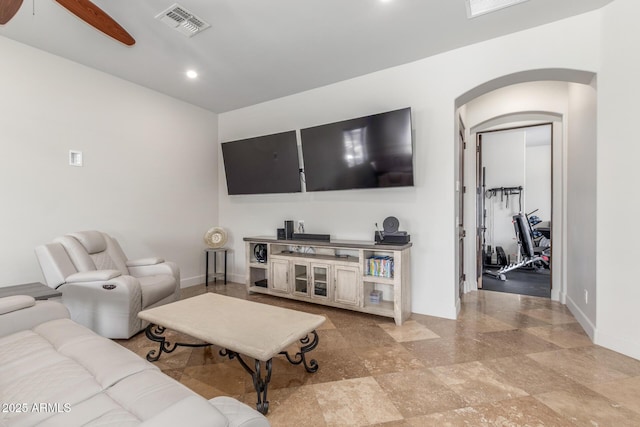 living room with visible vents, arched walkways, baseboards, ceiling fan, and recessed lighting