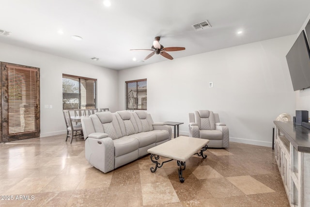 living room with baseboards, visible vents, a ceiling fan, and recessed lighting