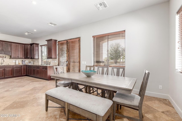 dining room with baseboards, visible vents, and recessed lighting