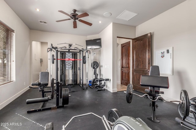 workout area featuring baseboards, visible vents, and ceiling fan