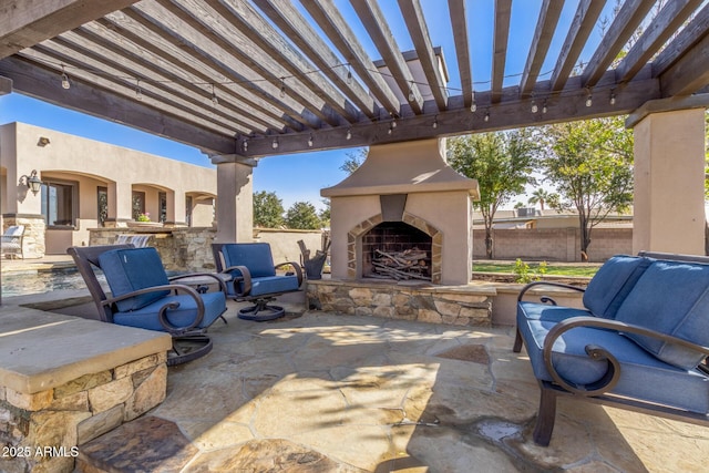 view of patio with an outdoor fireplace, fence, and a pergola