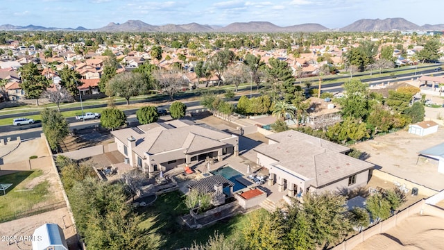 drone / aerial view featuring a residential view and a mountain view