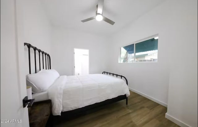 bedroom with ceiling fan and hardwood / wood-style flooring