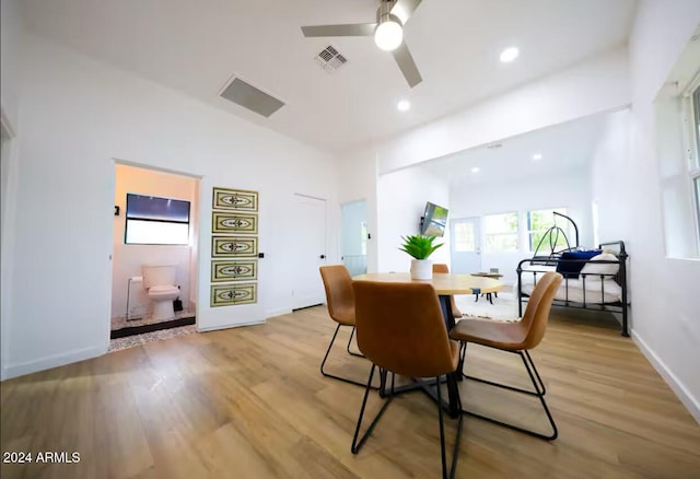 dining area featuring ceiling fan and light wood-type flooring