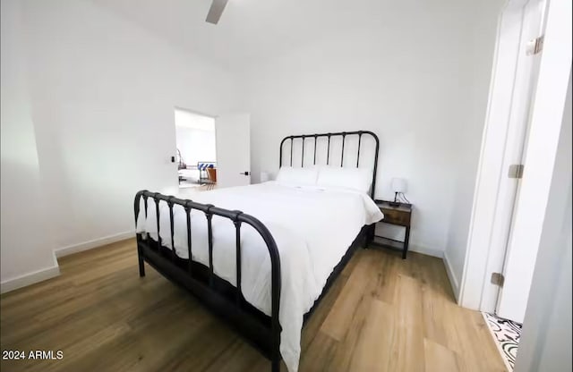 bedroom with ceiling fan and wood-type flooring